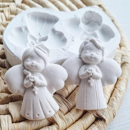 Molde duplo de anjos, com formas de menino e menina em relevo