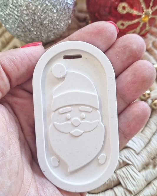 Molde branco do Pai Natal com relevo, formato oval e recorte tipo pega no topo