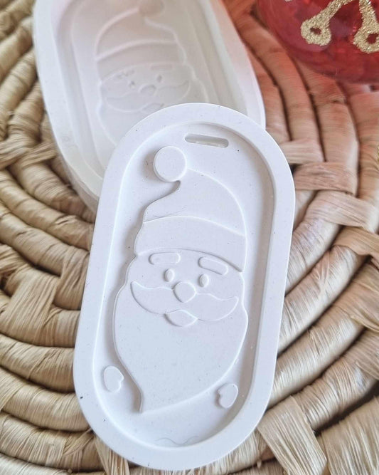 Molde branco em placa com relevo do Pai Natal, em formato oval e pega superior