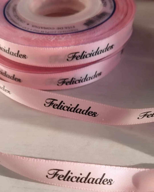 Fita decorativa rosa com texto 'Felicidades'
