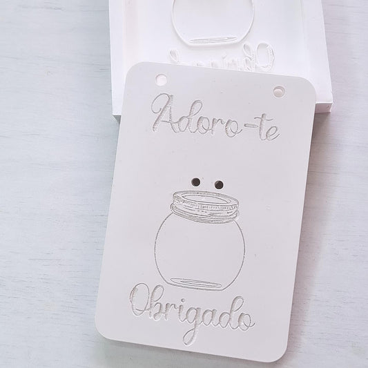 Molde de cartão branco com vaso e dedicatória «Obrigado» em relevo