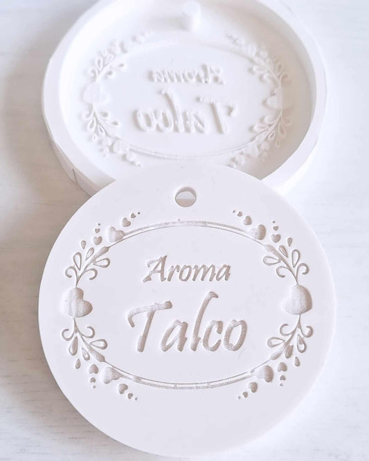 Molde circular branco com relevo “Aroma Talco” e motivos florais