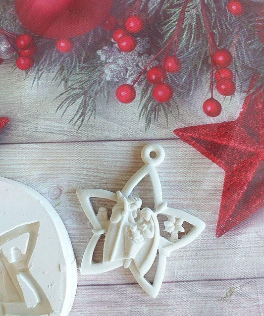 Molde de estrela para presépio com três figuras em relevo e base circular