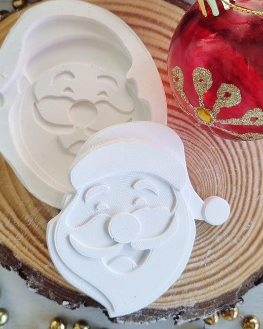 Molde branco de Pai Natal em relevo, formato circular com rosto e barba