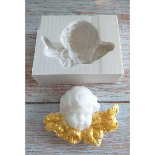 Molde de silicone com cabeça de anjo em relevo, com asas douradas