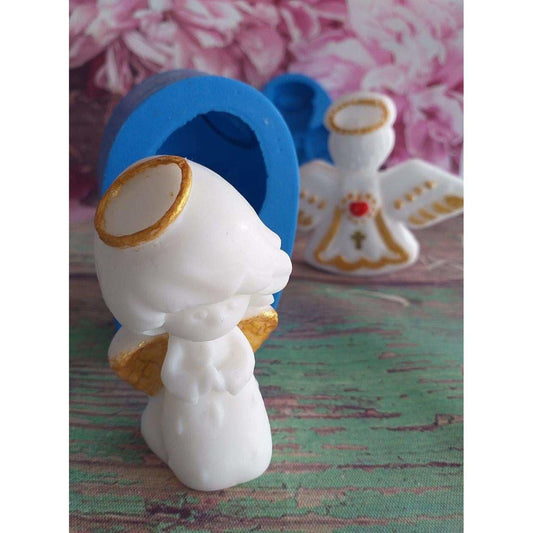 Molde de anjo em silicone azul com figura branca e coroa lateral oval dourada.