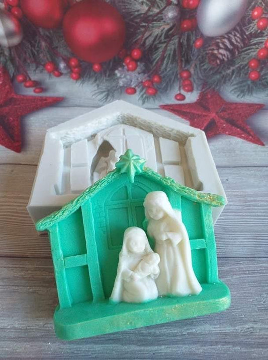 Molde de presépio em forma de cabana verde com figuras do Nascimento em branco