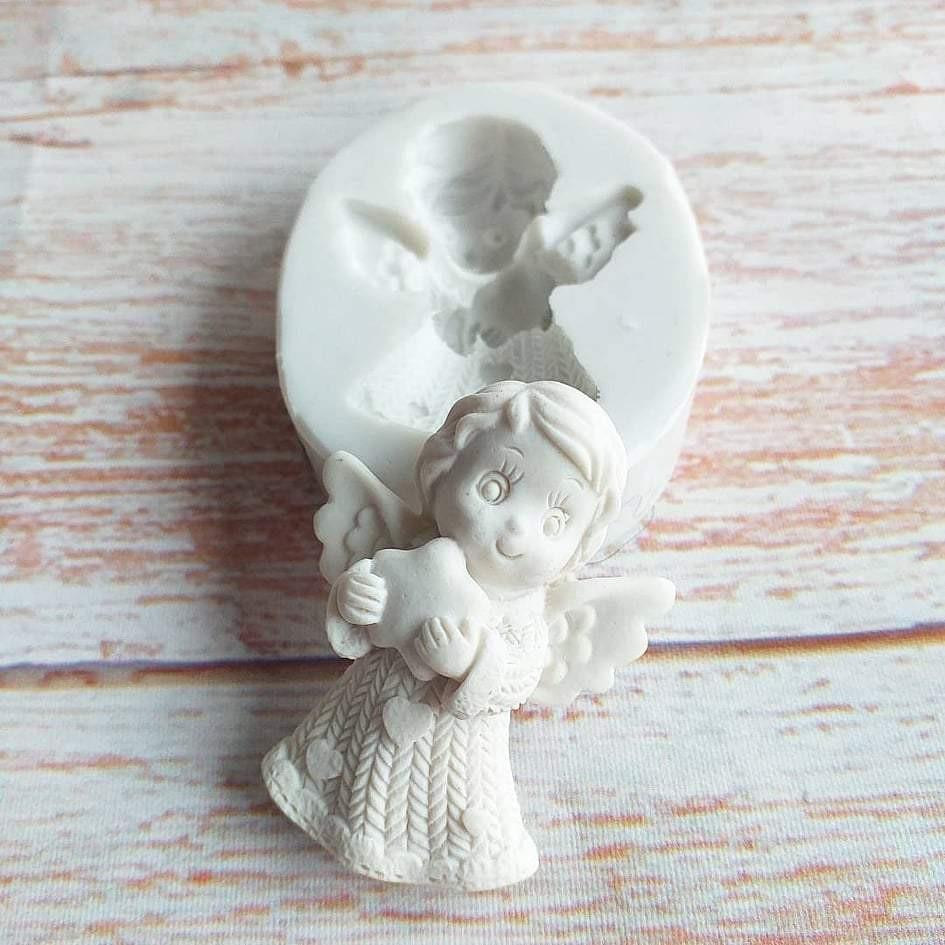 Molde redondo 2D de anjo em relevo, com criança e mãos agarradas