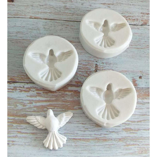 Molde de pomba: moldes redondos com relevo de pomba e peça decorativa branca